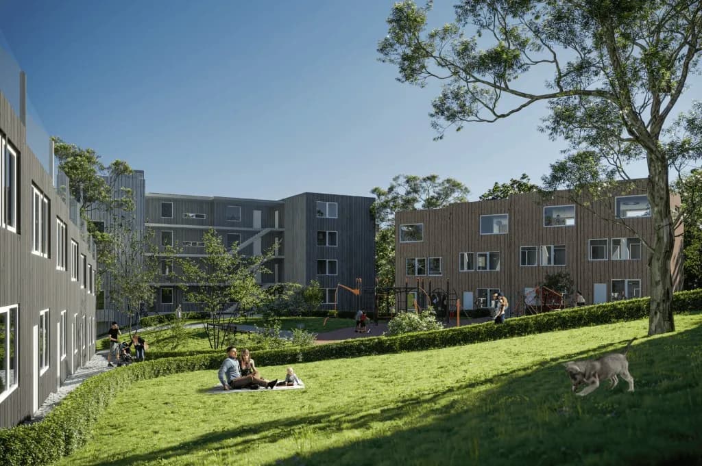 Illustrasjon av leilighetsbygg rundt et tun med lekeplass
